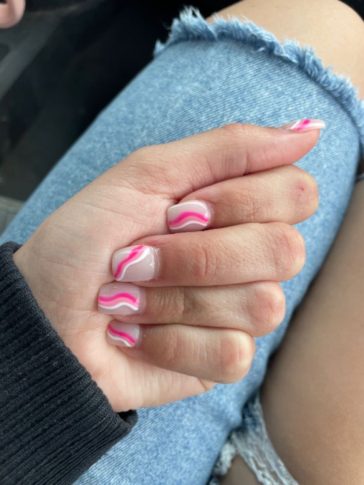 Vibrant Pink Swirling Nail Art: A Trendy Twist on Classic Manicure