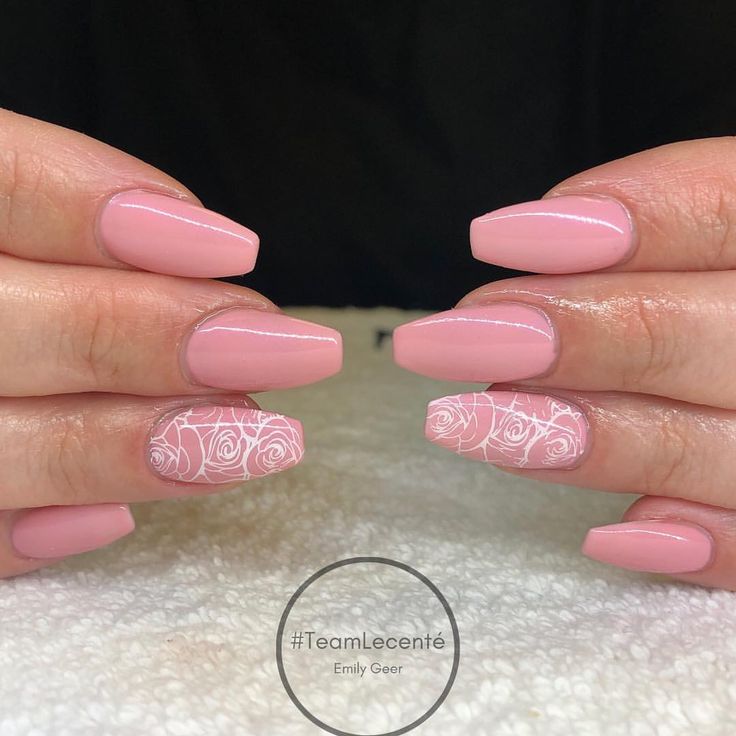 Charming Pink Nail Design with Floral Patterns and Almond Shapes for Any Occasion