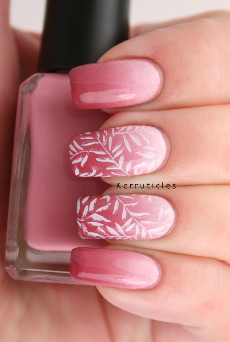 Elegant Pink Gradient Nail Design with Leaf Accents.