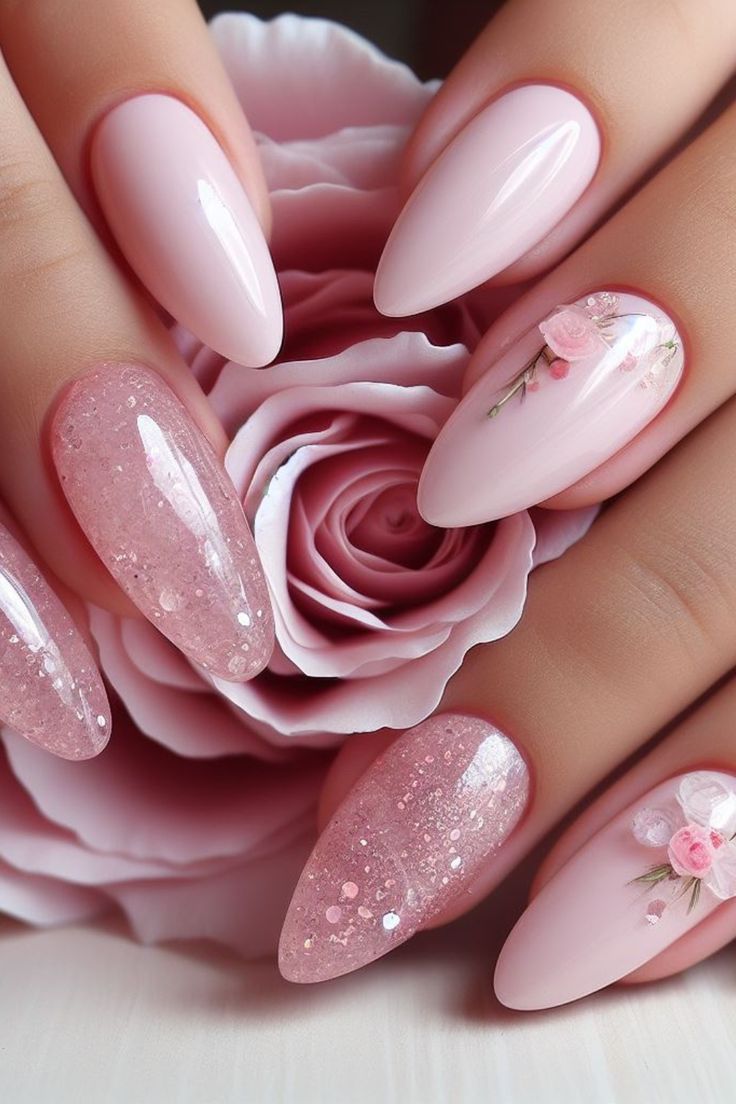 Romantic Soft Pink Nail Design with Glossy Textures and Floral Accents.