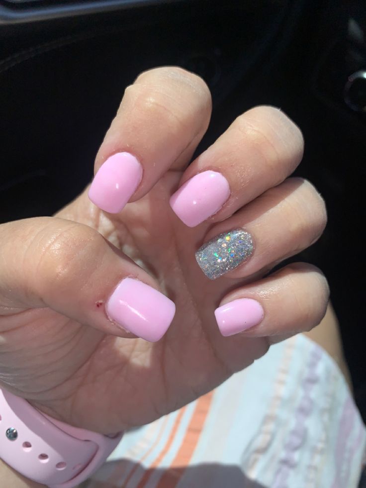 Elegant Soft Pink Nail Design with Glossy Finish and Sparkly Accent.