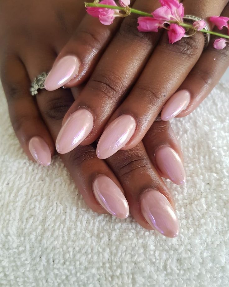 Chic Elegant Nude Manicure with Almond-Shaped Nails and Delicate Floral Accents