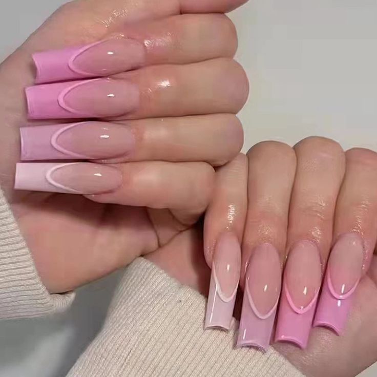 Elegant Pink Ombre Nails: A Sophisticated Blend of Soft Hues and Glossy Finish.