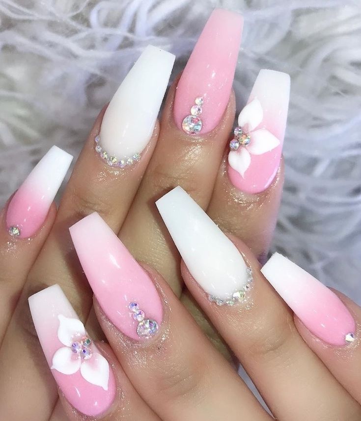 Elegant Ombre Nail Design with Floral Accents and Colorful Rhinestones for Chic Occasions.