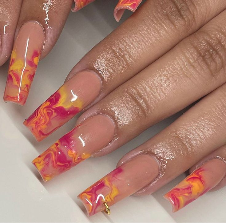 Vibrant Pink and Yellow Swirl Marble Nail Design for Bold Style Expression.