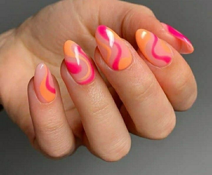 Vibrant Swirl Nail Design: A Playful Blend of Pink, Orange, and Peach with Glossy Finish.