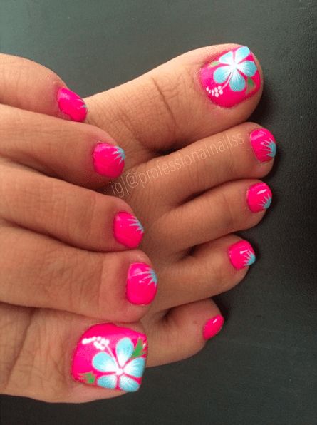 Tropical Floral Pink Nail Design with Blue and White Accents.