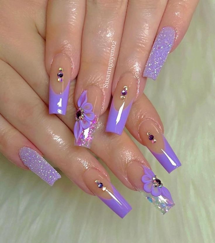 Elegant Lavender Nail Art with Textures and Embellishments.