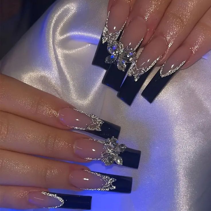 Stunning Elegant Nail Design with Nude, Deep Navy, Rhinestones, and Glitter Accents