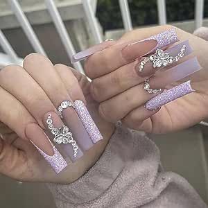 Elegant Glittering Lavender Acrylic Nails with Floral Accents and Gemstones.