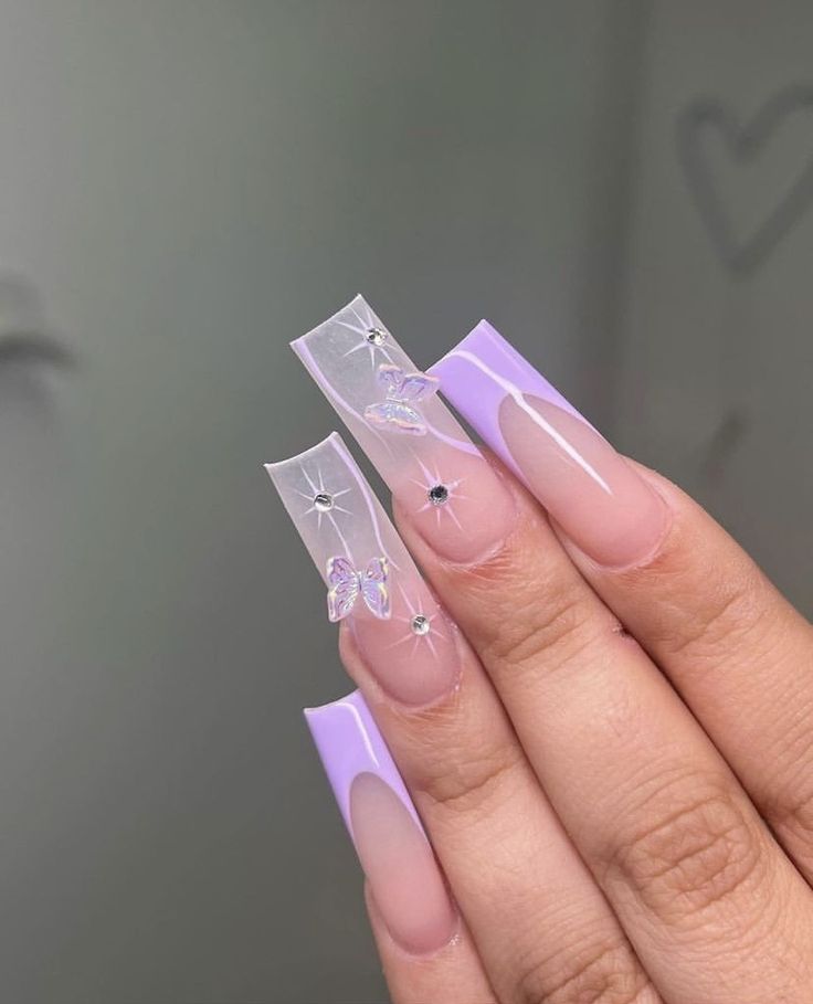 Sophisticated Nail Design: Glossy Clear Tips with Butterfly and Star Accents in Soft Lavender.