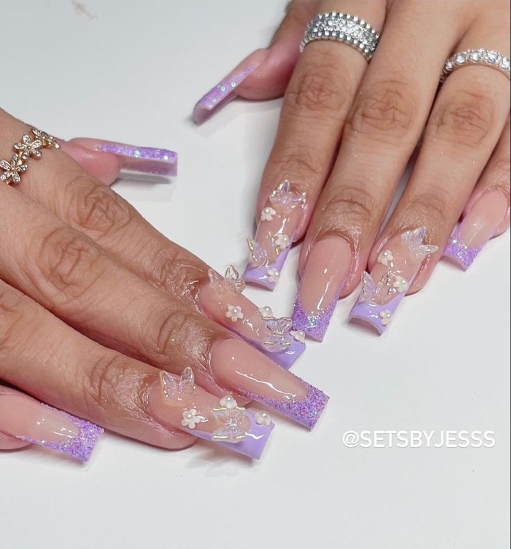 Elegant Lavender and Glitter Gradient Nail Design with Butterfly and Floral Accents