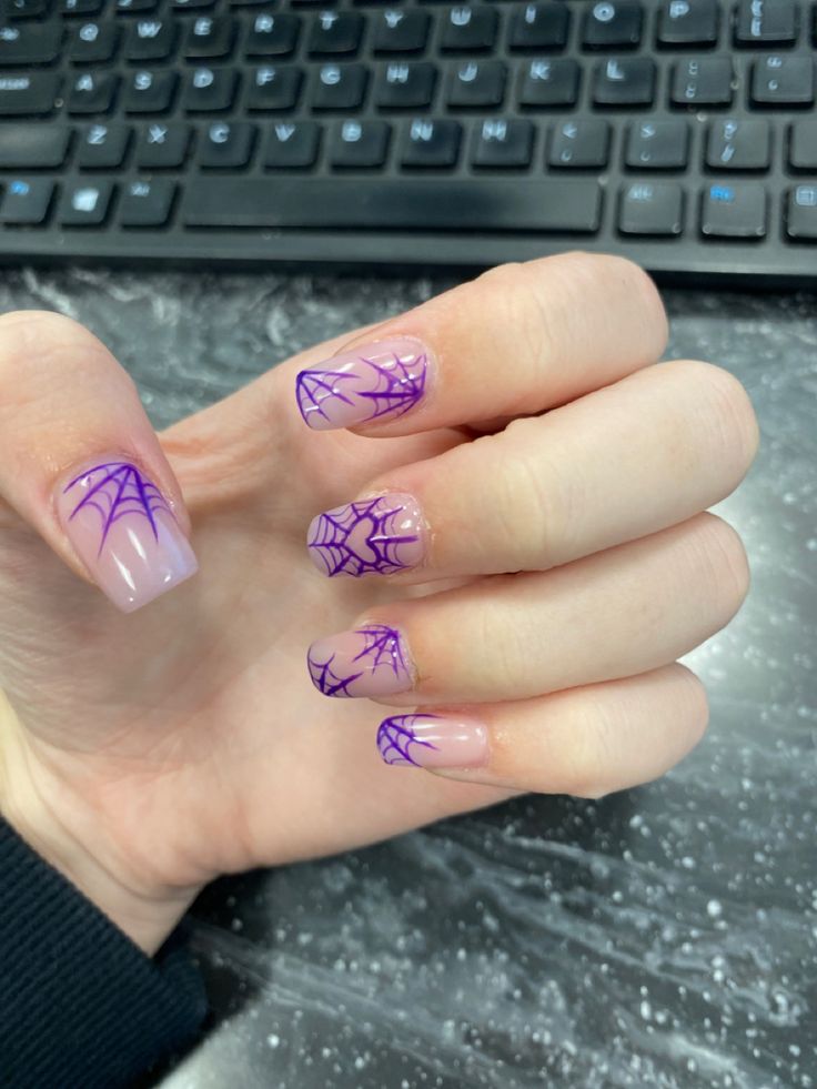 Whimsical Lavender Spiderweb Nail Design for Autumn and Halloween