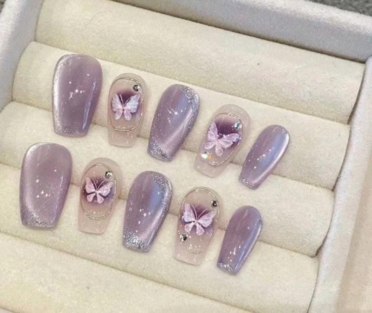 Elegant Lavender Nail Design with Intricate Butterfly Accents and Glossy-Matte Finishes