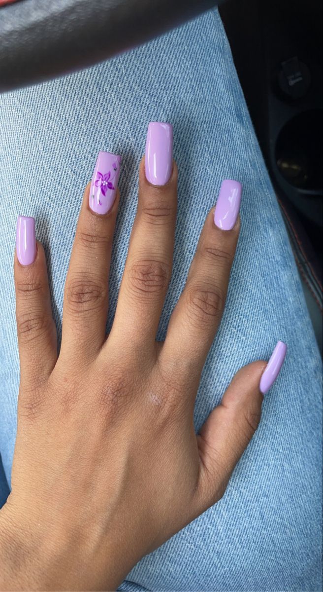 Chic Vibrant Lilac Nails with Floral Accent for a Playful Modern Aesthetic.