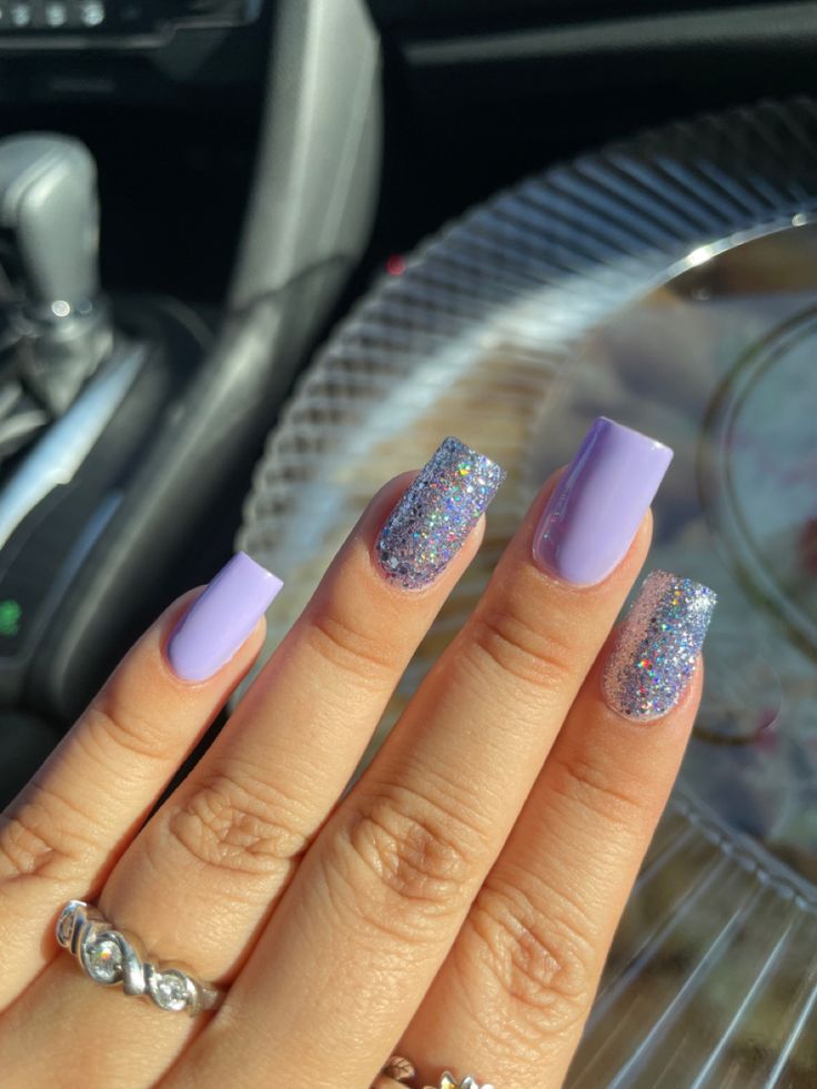 Chic Nail Design: Elegant Lavender Base with Glittery Silver Accents