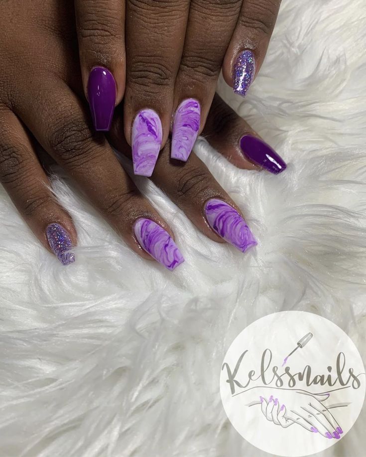 Elegant Deep Purple and Lavender Swirled Nail Design with Glitter Accents.