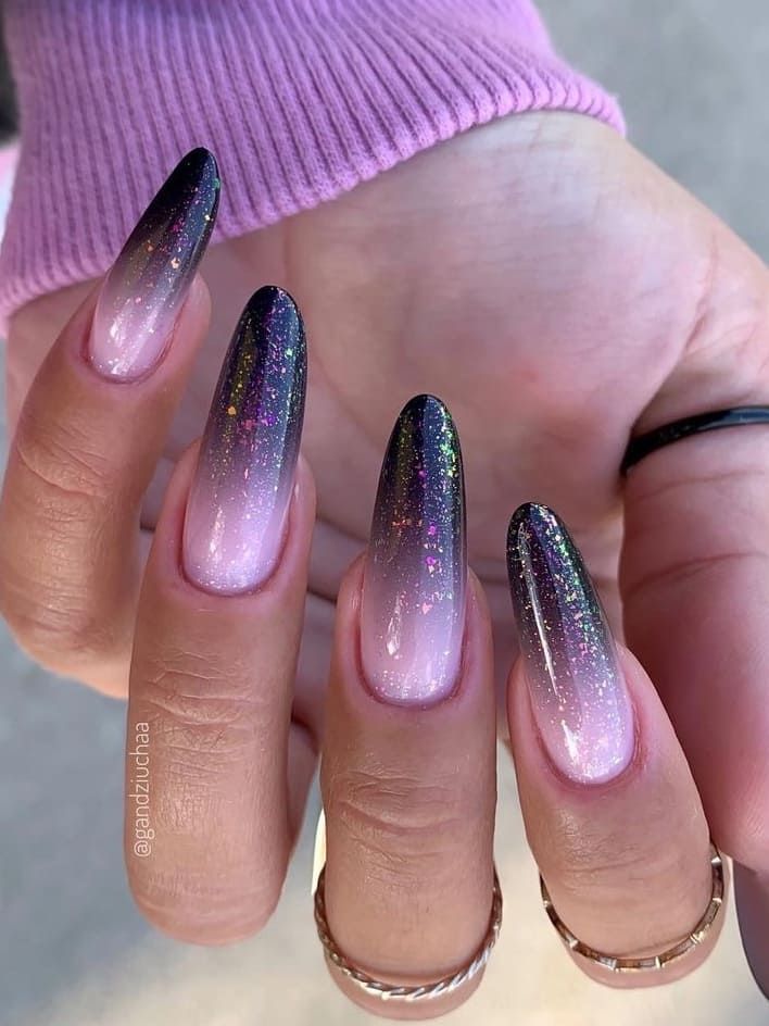 Elegant Ombre Nail Design: Deep Black to Soft Pink with Glitter on Stiletto Nails