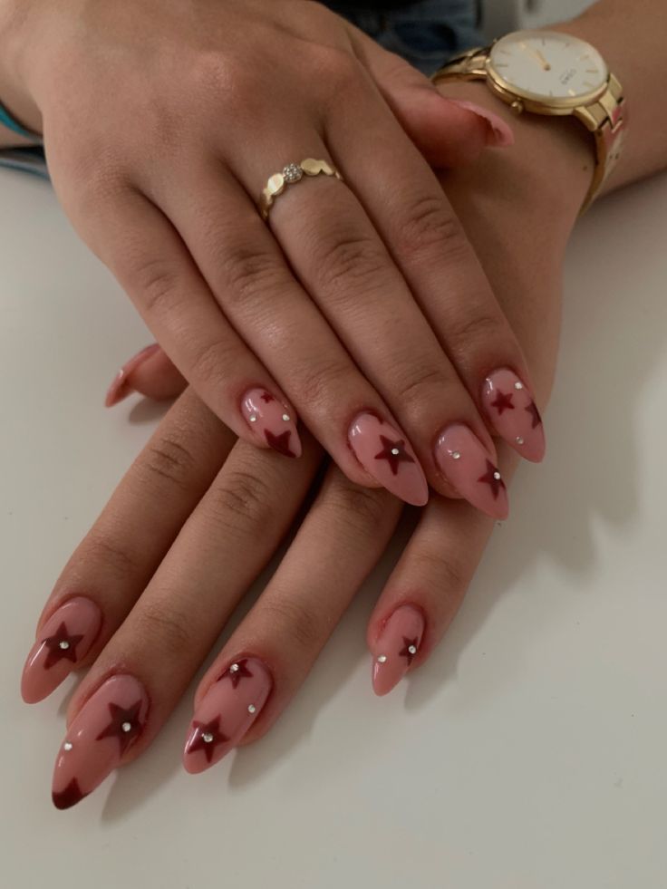 Chic Nude and Pink Gradient Nail Design with Playful Star Accents