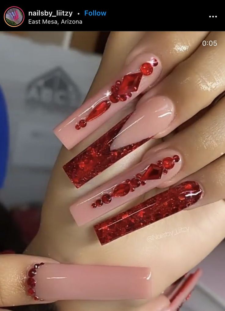 Elegant Nail Design: Glossy Pink Base with Bold Red Glitter and Gem Accents