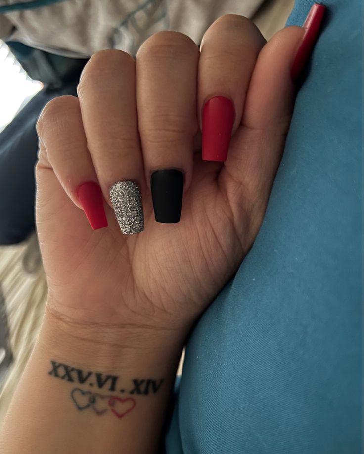 Bold Trendy Nail Design: Bright Red, Matte Black & Glittering Silver Accents for a Modern Statement.