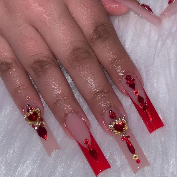 Luxurious Red Ombre Long Nails with Shimmering Embellishments for Romantic Occasions.