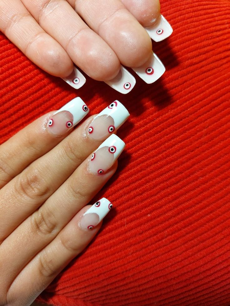 Chic Nail Design: Classic White Base with Bold Red and Black Accents on Vibrant Red Background