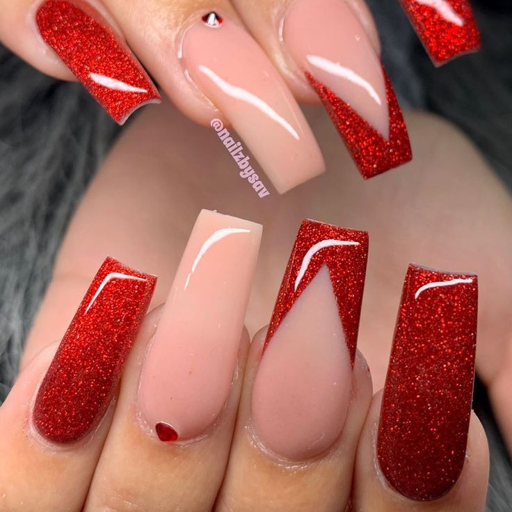 Bold Glittery Nail Design: Deep Red and Soft Nude with Geometric Shapes and Sparkly Accents.