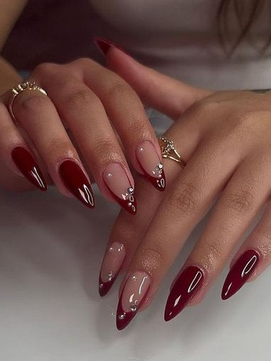 Elegant Gradient Red and Nude Nail Design with Glossy Finish and Silver Accents