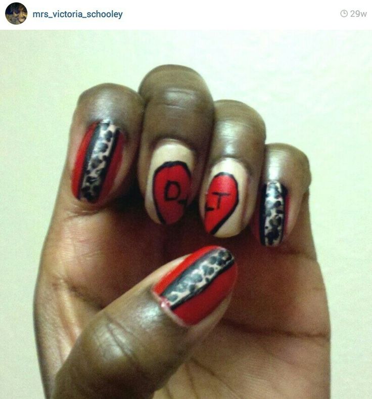 Trendy Nail Design: Bold Red, Black, and Beige with Leopard Print and Heart Motifs