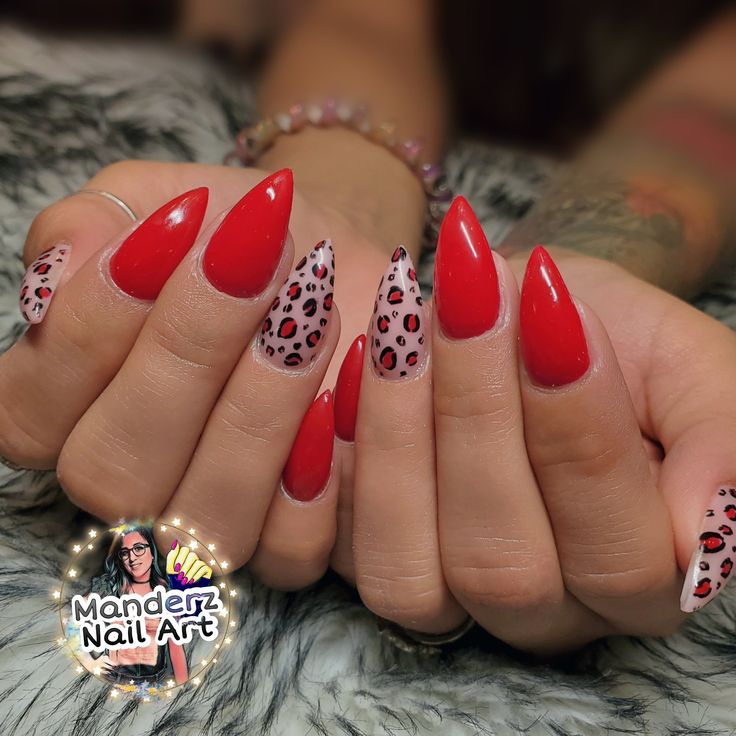 Bold Stiletto Manicure: Vibrant Red with Playful Leopard Print Accents.