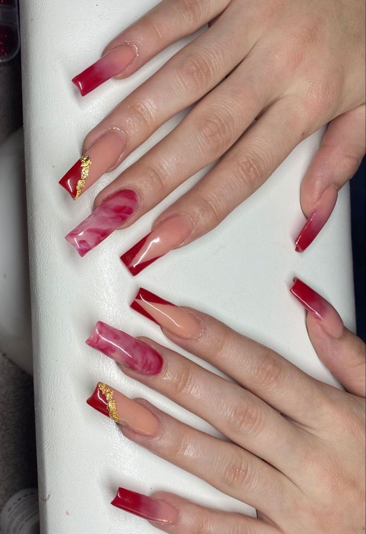 Chic Nail Design Featuring Vibrant Red, Soft Nude, and Elegant Metallic Accents