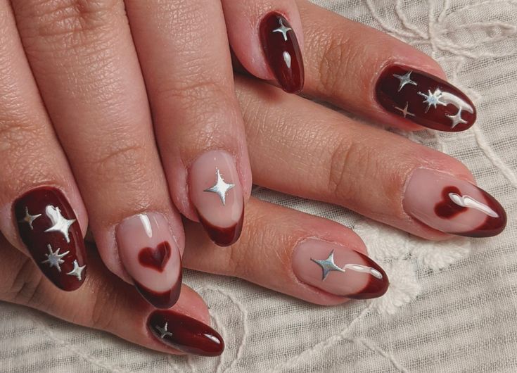 Whimsical Sophistication: Elegant Burgundy Nail Design with Silver Stars and Hearts