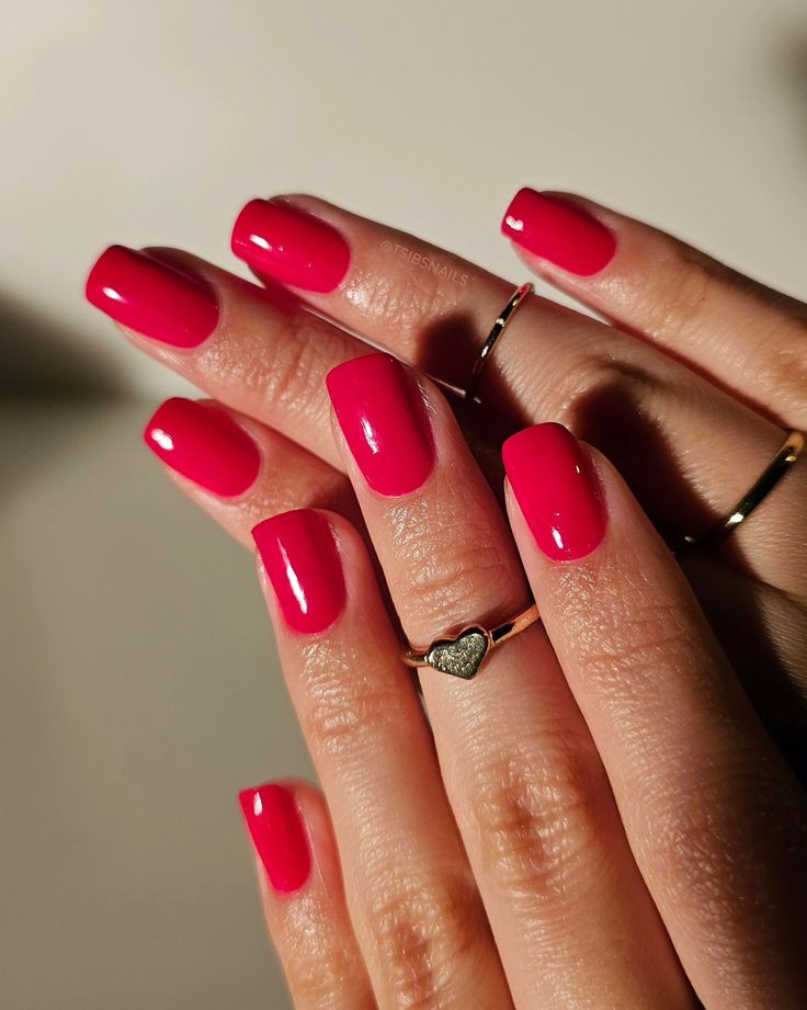 Elegant Vibrant Pink Nail Design with Glossy Finish and Square Shapes.