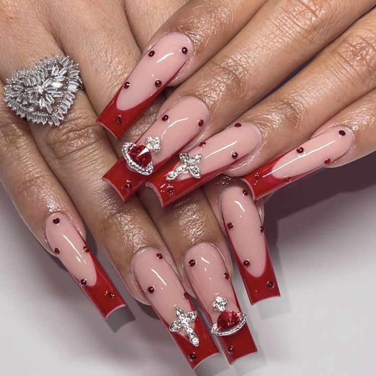 Elegant Nude and Glossy Red Nail Design with Gems and Heart Embellishments