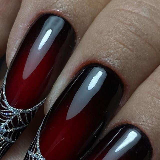 Dramatic Ombre Nail Design: Deep Red to Black with Elegant Silver Spiderweb Detailing