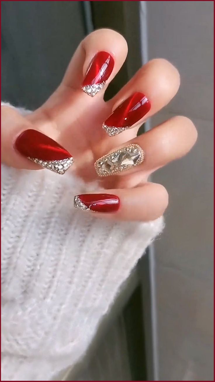 Glamorous Elegant Red French Tip Nails with Glossy Finish and Rhinestone Accents.