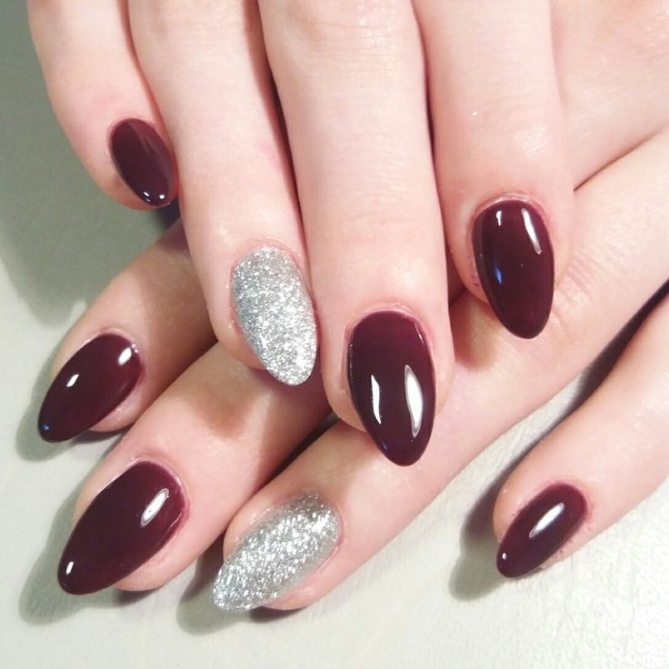 Chic Burgundy Manicure with Glossy Shades and Dazzling Silver Accents.