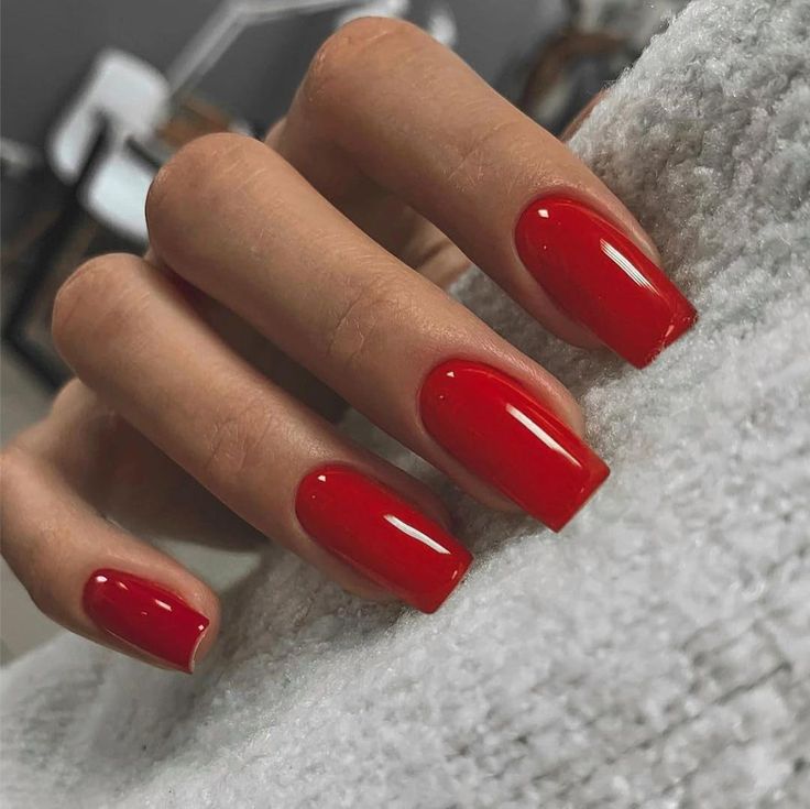 Sophisticated Elegant Red Nail Design with Glossy Finish for Any Occasion.