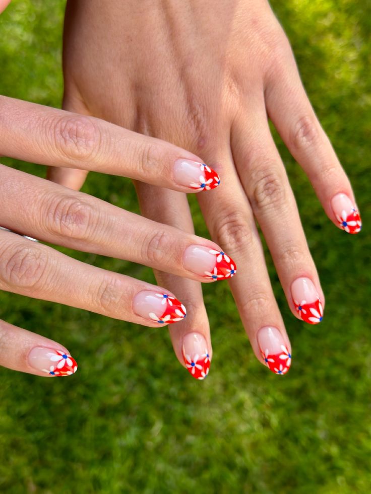 Vibrant Floral French Manicure with Bold Red Tips