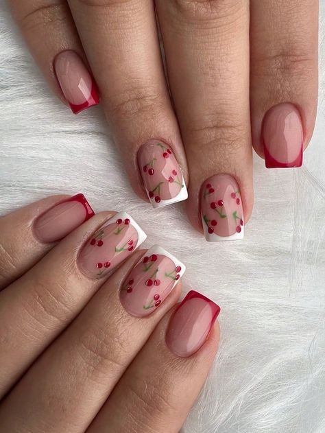 Charming Pink and Red Nail Design with Delicate Cherry Blossom Patterns and Bold Tips.