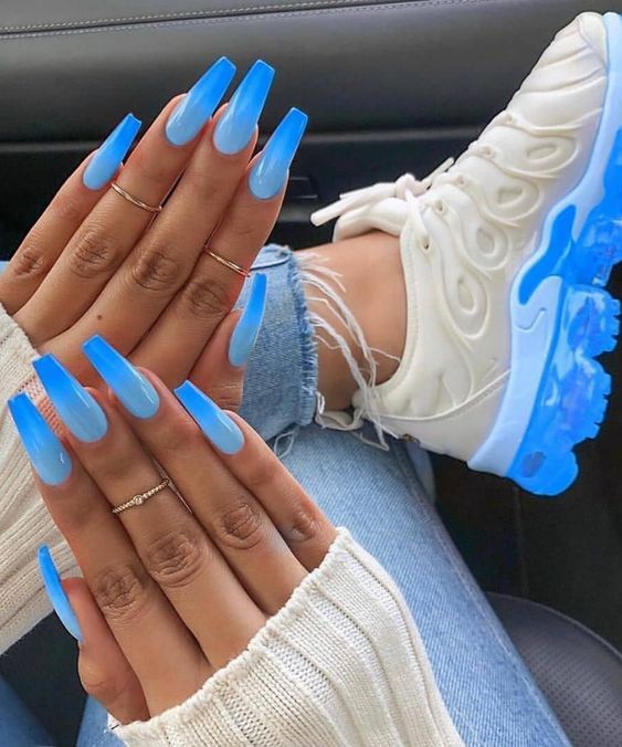 Chic Gradient Blue Long Nails Complemented by Trendy White Sneakers.