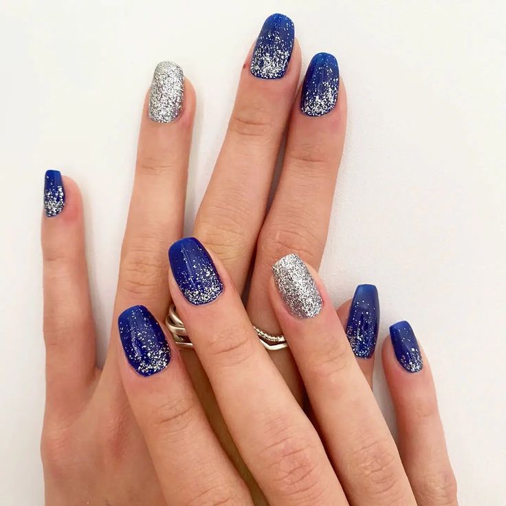 Chic Deep Blue and Sparkling Silver Nail Design Ideal for Special Occasions.