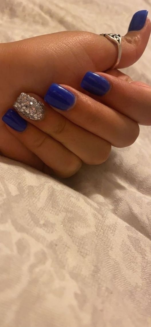 Chic Blue Nail Design with Glossy Finish and Glamorous Rhinestone Accent