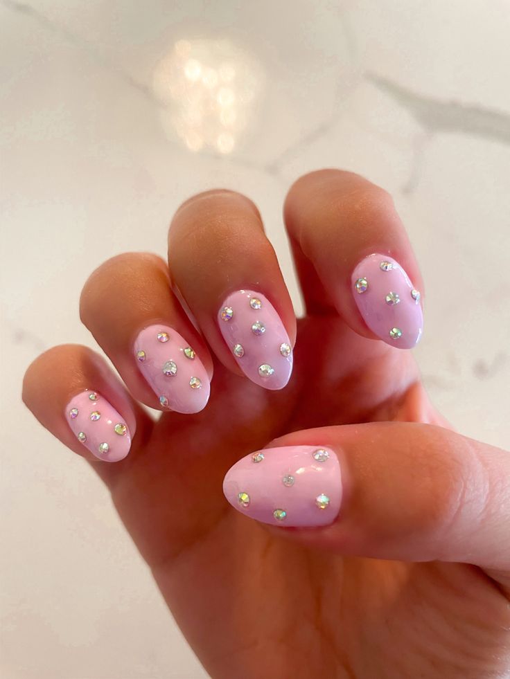 Charming Sophistication: Elegant Pastel Pink Nails with Sparkling Rhinestones