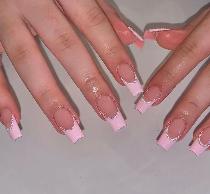 Chic Pink French Tip Nails with Sparkling Accents and Glossy Finish.