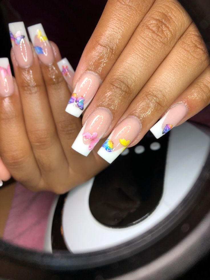 Chic Nail Design: Playful Butterfly Accents on Classic French Tips