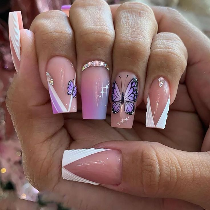 Whimsical Gradient Pink Butterfly Nail Design with Sparkling Gems and Modern Geometric Accents