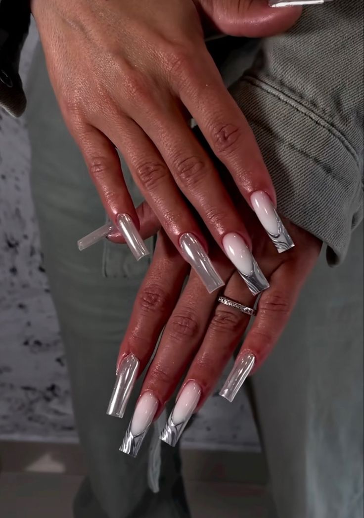 Chic Ombre Pink Nails with Glossy Silver Tips for a Bold Statement.