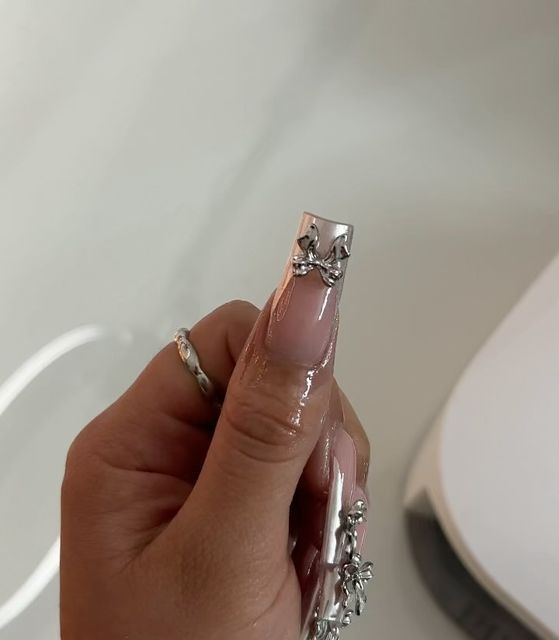 Chic Long Square Nail Design with Intricate Silver Detailing on Clear Base